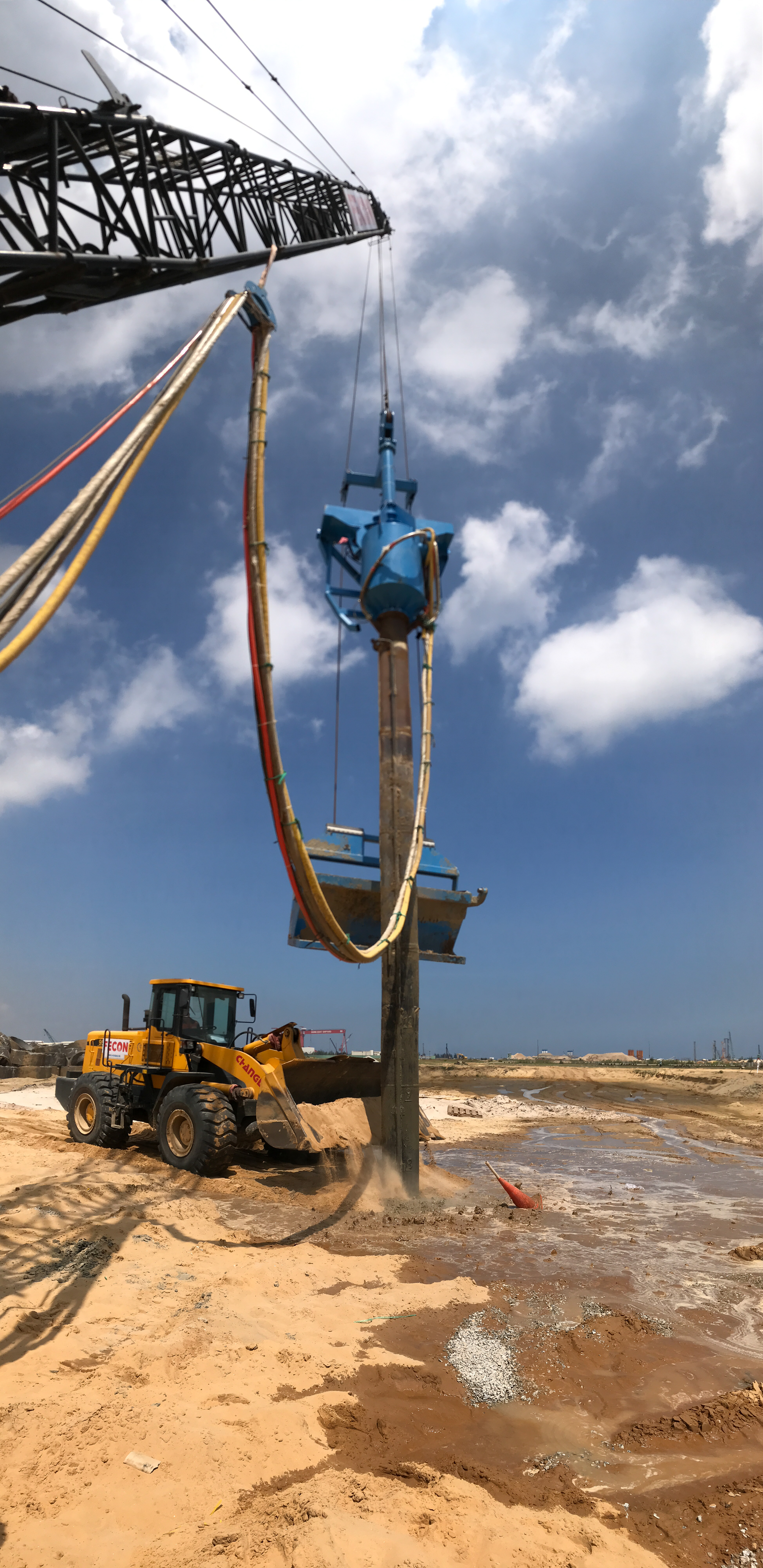 BC1 with skip bucket and loader to supply gravel.